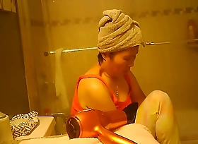 Asian mature caught showering out of reach of hidden camera